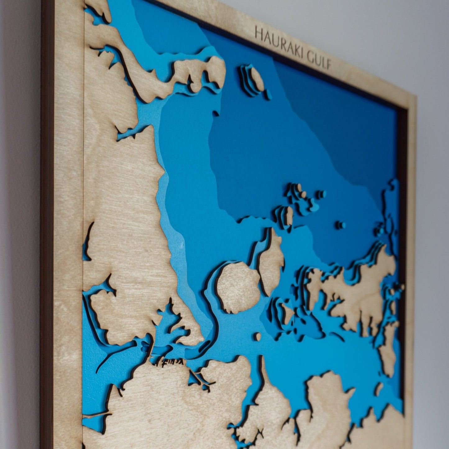 Close-up view of the Hauraki Gulf Small map showing detailed laser-cut bathymetric layers and coastal features.