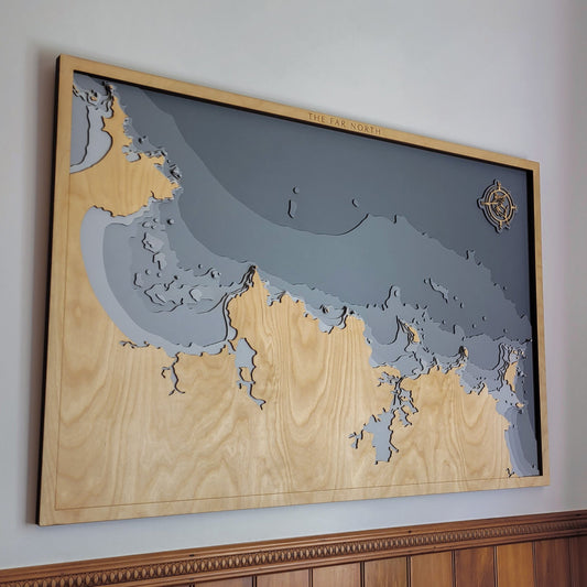 Extra-large handcrafted wooden depth map of New Zealand's Far North region, featuring laser-cut birch layers illustrating sea depths from sea level to -200 meters, highlighting Doubtless Bay, Whangaroa Harbour, and the Cavalli Islands.