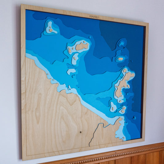 Handcrafted wooden depth map of Hahei Beach, Coromandel Peninsula, New Zealand, featuring laser-cut European Birch layers illustrating sea depths from sea level to -34 meters