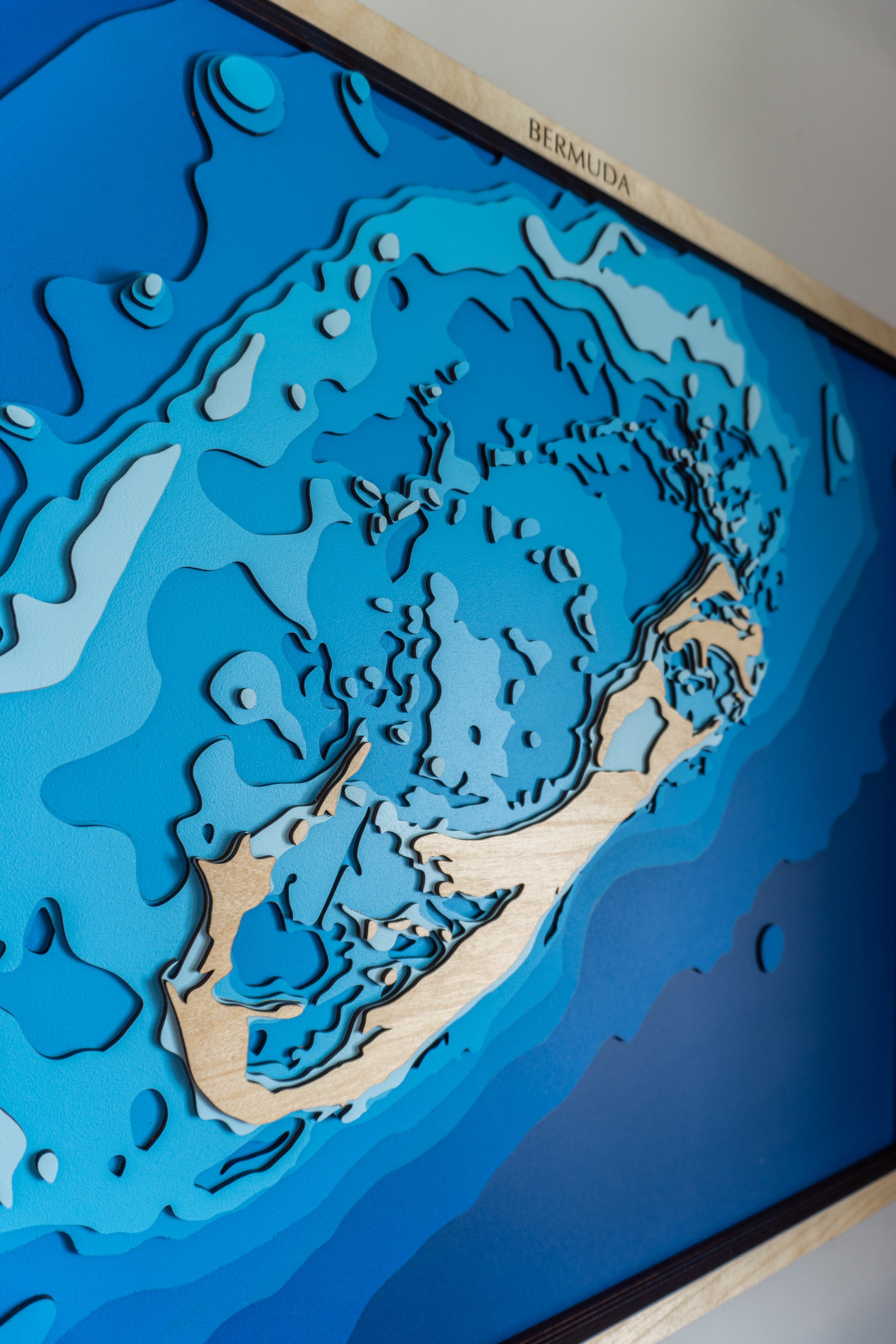 Topographic map of Bermuda with blue water and beige landmasses