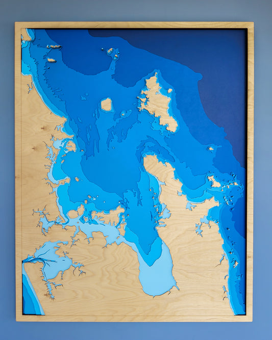 Extra-large custom wooden depth map by Tide's Out Maps, featuring laser-cut European Birch layers up to 120x80cm, showcasing personalized coastal or lake designs.