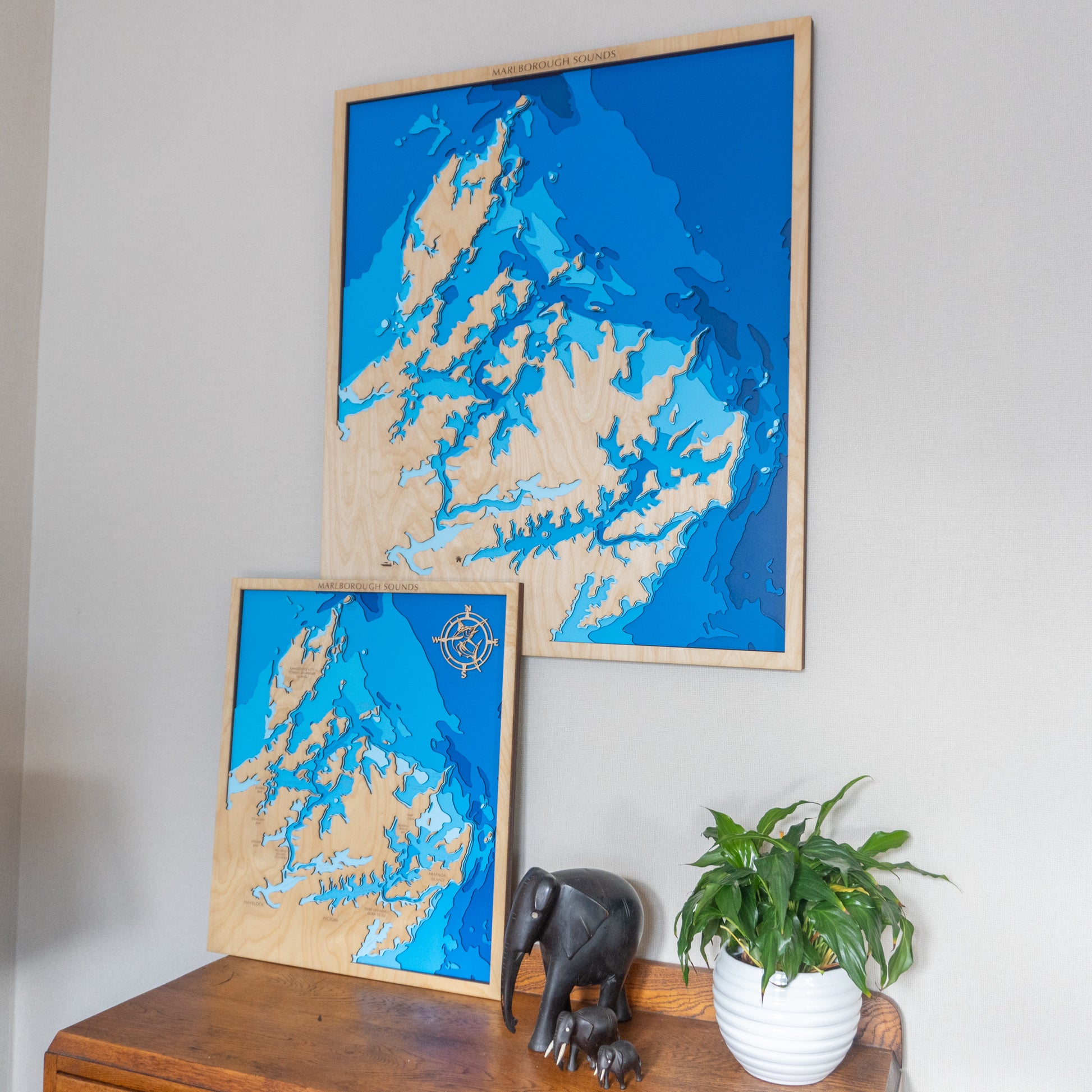 Close-up view of the Marlborough Sounds XL wooden map showing detailed laser-cut bathymetric layers and coastal features.