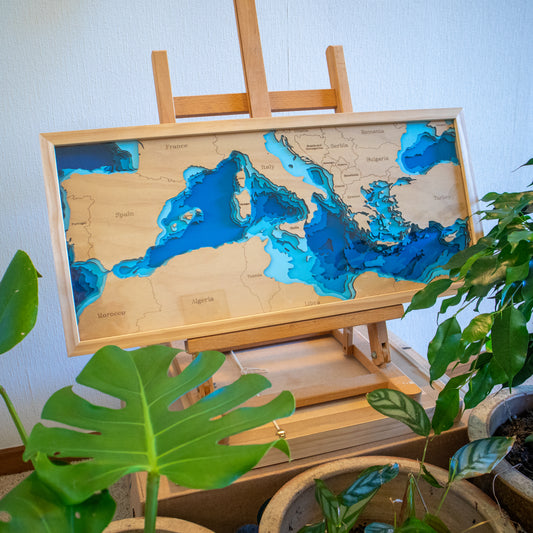 Handcrafted wooden depth map of Europe and the Mediterranean Sea, showcasing laser-cut layers depicting the region's coastlines, islands, and surrounding bathymetric contours.