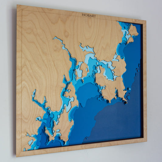 Handcrafted wooden depth map of Hobart, Tasmania, showcasing laser-cut layers depicting the Derwent River, Mount Wellington, and surrounding coastal features.