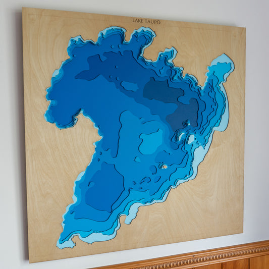 Extra-large wooden depth map of Lake Taupō, New Zealand, featuring laser-cut layers illustrating depths from 0m to -160m, highlighting the lake's contours and surrounding topography.