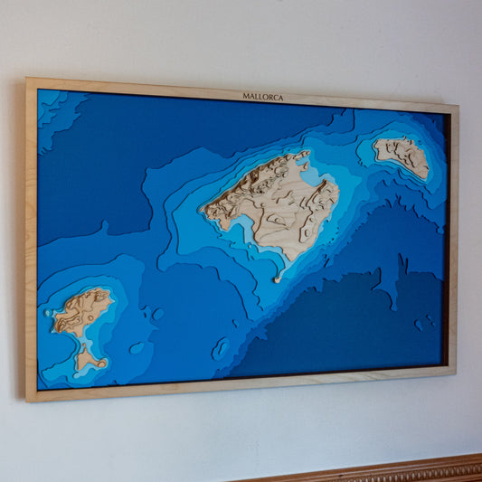 Framed topographic map of Mallorca on a white wall