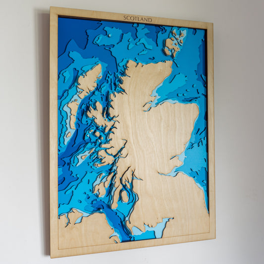 Handcrafted wooden depth map of Scotland, featuring laser-cut layers illustrating sea depths from sea level to -500 meters, highlighting the country's intricate coastline and surrounding bathymetric contours.