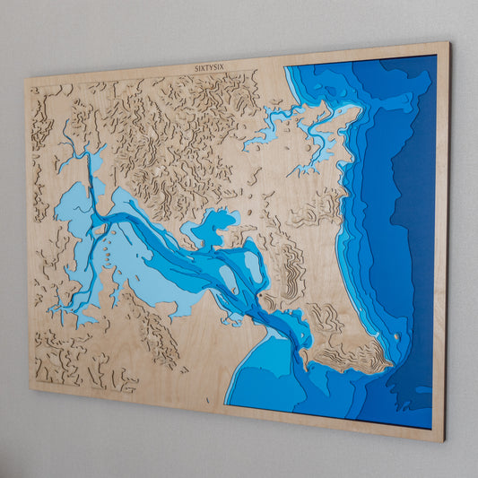 Laser-cut wooden depth map of Whangarei Harbour, showcasing detailed bathymetric contours in layered European Birch plywood.