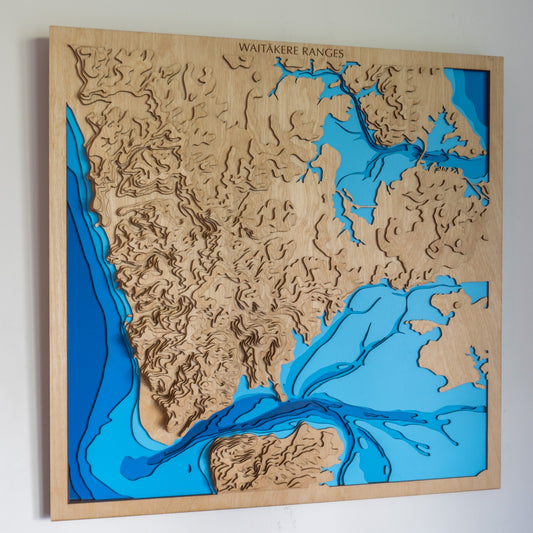 Waitākere Ranges wooden topographic map - layered west Auckland ranges, wild west coast beaches and the Manukau Harbour entrance